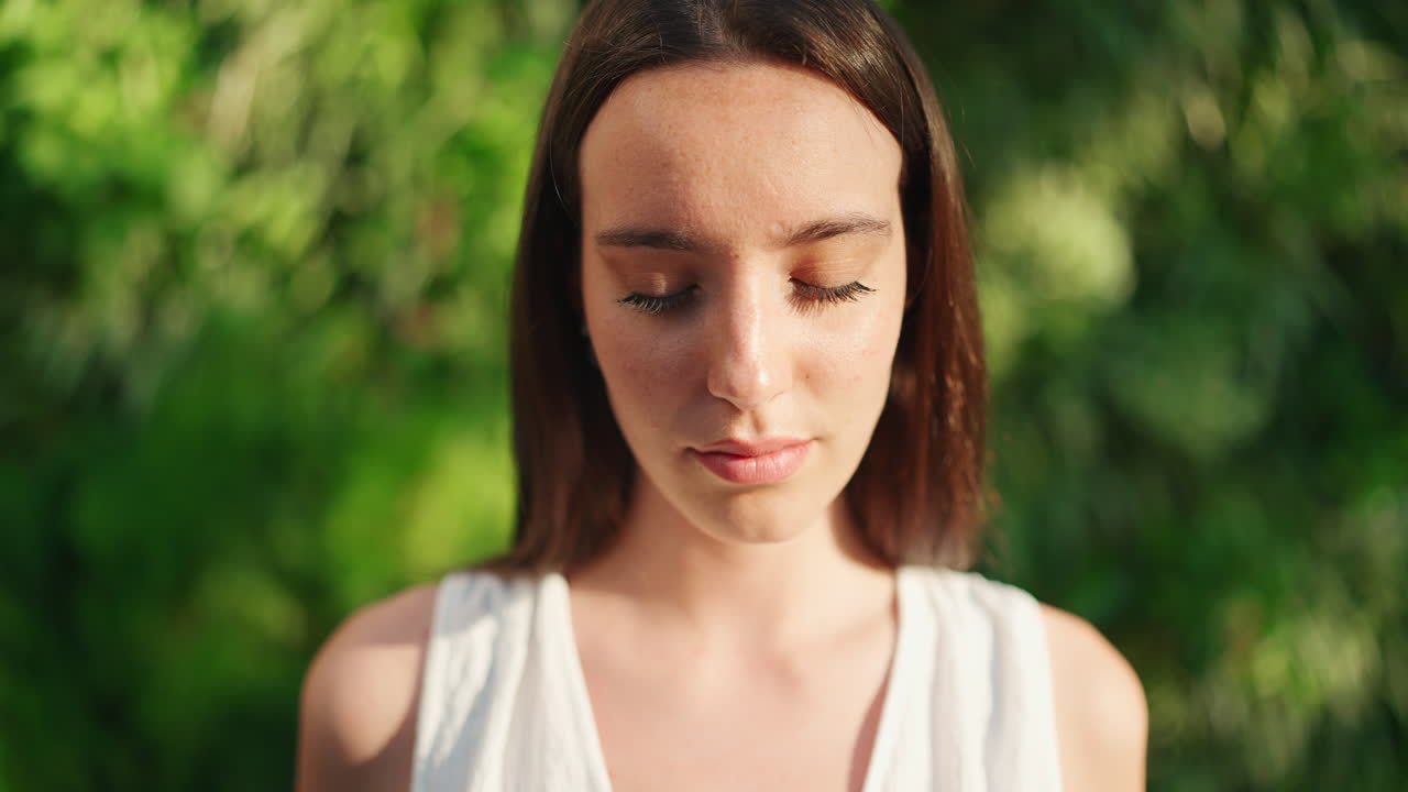 Portrait of a beautiful brunette woman with freckles