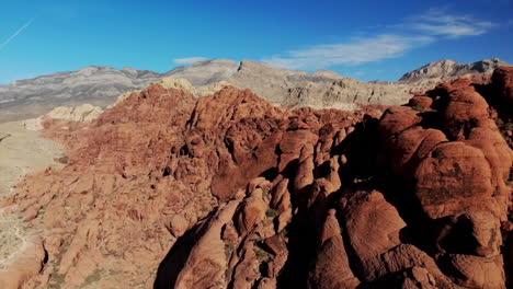 aerial views alongside red sandstone mountains at red rock canyon park in nevada