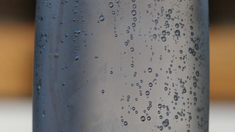 Stationary-view-of-sparkling-water-bubbles-slowly-rising