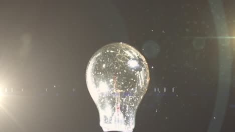 animation of light bulb glowing networks hit by ball and copy space