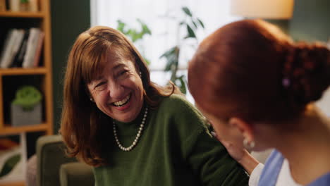 senior woman laughing with her caregiver