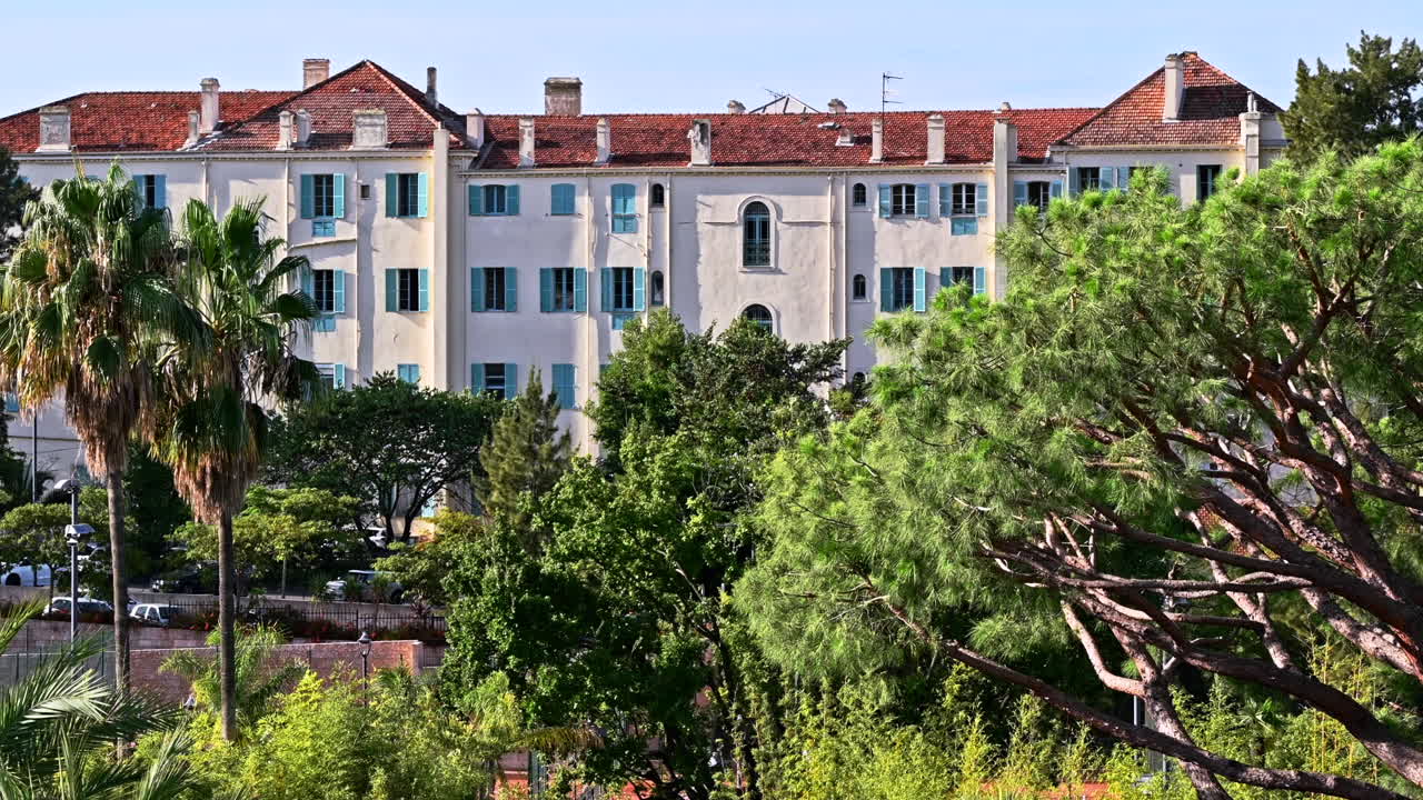 Streescape of Cannes, France. Traditional residential building, a lot of greenery