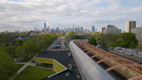 drone flying above exelon tube, chicago skyline in background