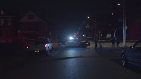 police car blocking off road at night