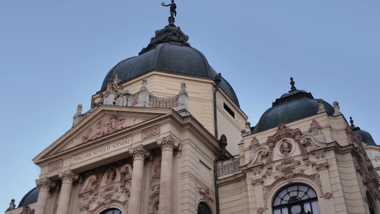 Close-up of the National Theatre of Pécs facade, highlighting ornate architectural details and historic European charm