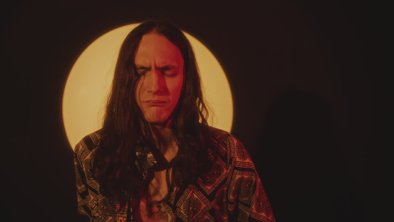 Handsome Musician Playing Guitar and Performing Rock Concert in Studio