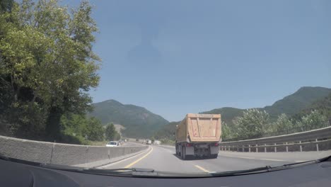 city, nature and traffic view from the camera inside the vehicle.