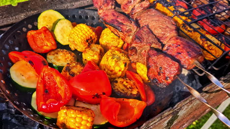 barbecue grill with skewered meat and assorted grilled vegetables