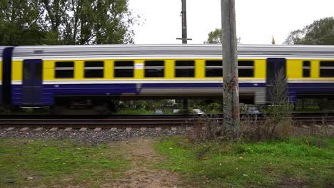 platform on latvia main train station with entering train and exiting station