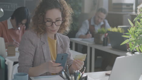 woman paying bill in modern office