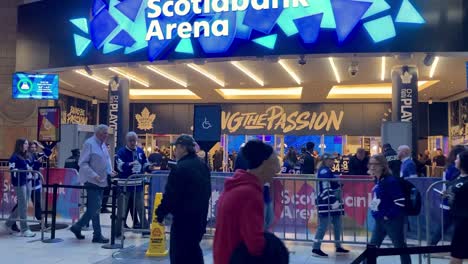 fans entering scotiabank arena in downtown for a toronto maple leafs nhl playoff game.