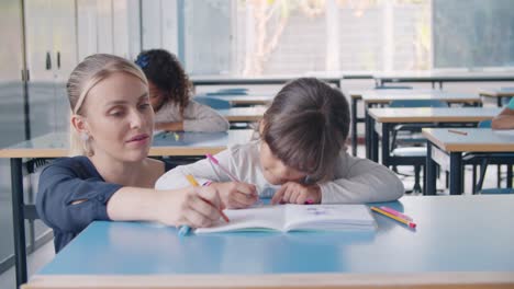 primary school teacher showing and explaining task