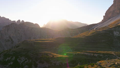 sunlit tre cime mountain peak aerial view across south tyrol shaded nature park landscape