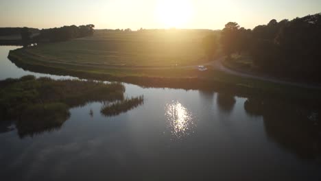 Aerial-footage-of-the-fly-over-the-lake-during-the-sunset