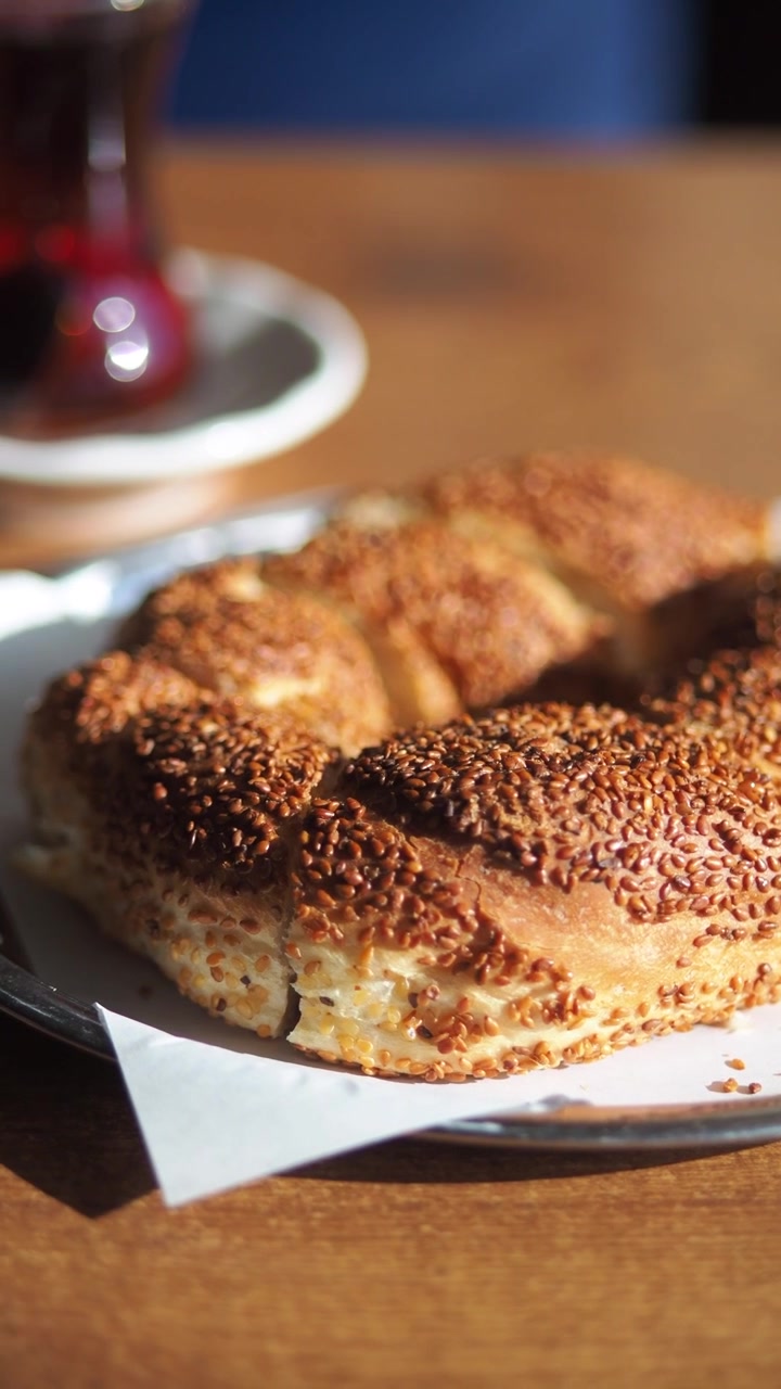 Close-up of a Traditional Turkish Simit with Sesame Seeds and Tea