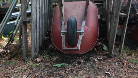 still shot of wheelbarrow parked in compost bin