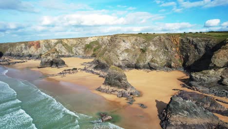 bedruthan steps along the cornish coastal cliffs near wadebridge from an aerial drone