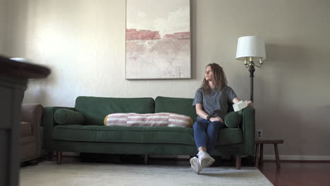 a wide shot features a woman looking sad and stoically into the distance. the camera slowly slides from left to right, emphasizing her emotional state and the surrounding atmosphere.