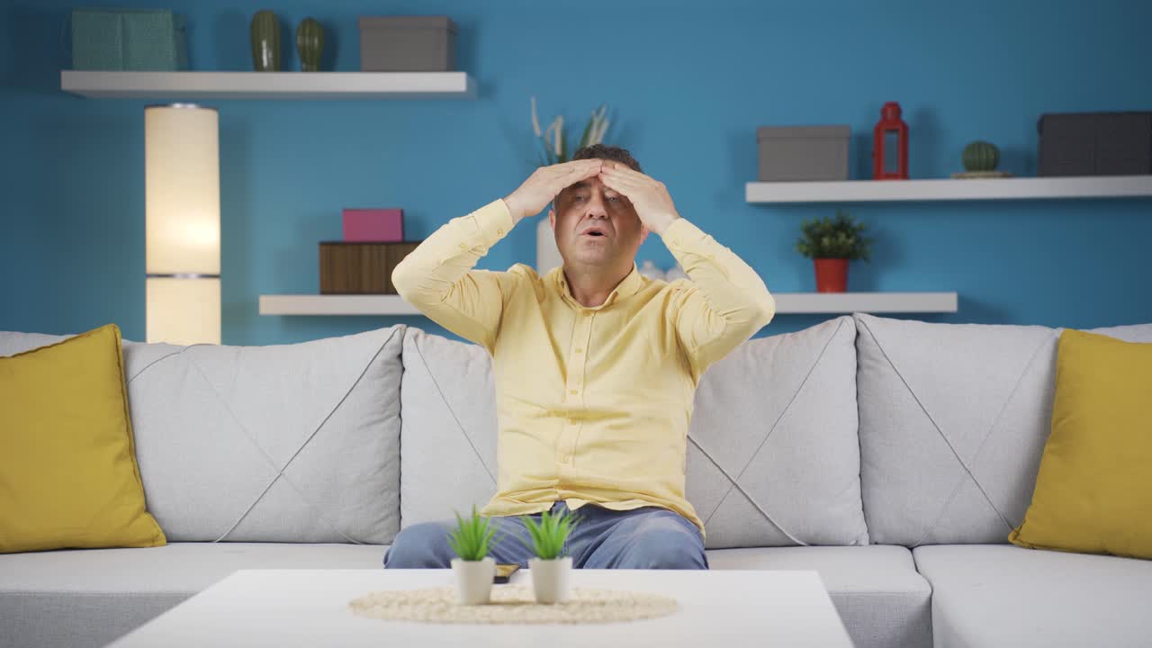 두통이 있는 남자.