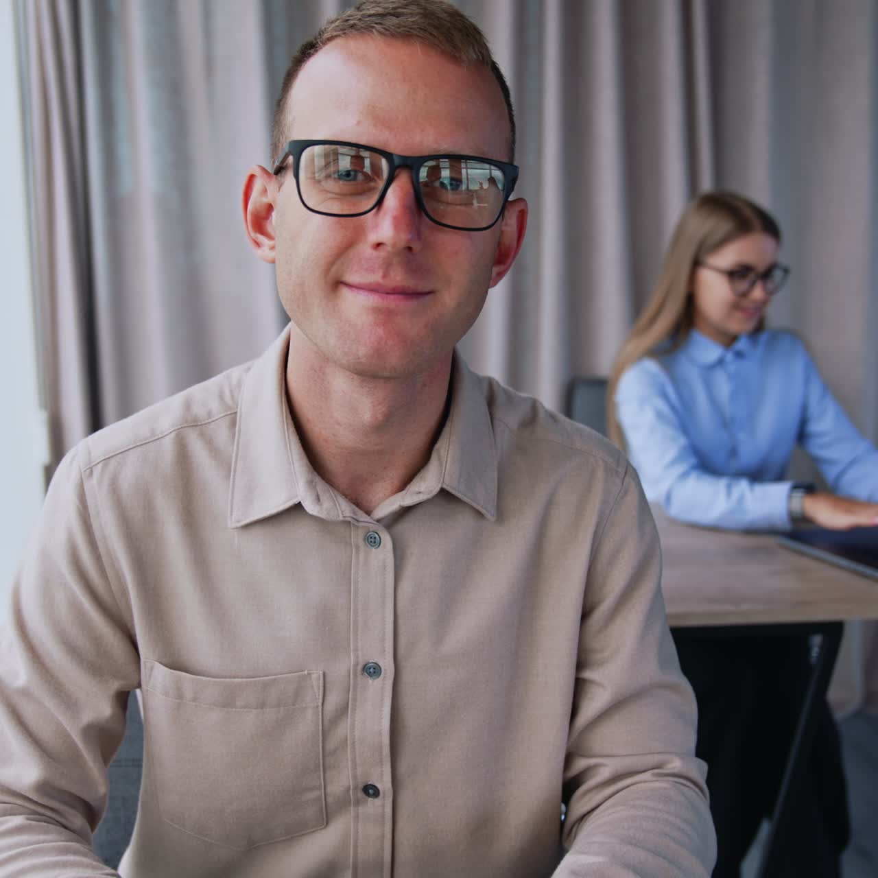Young confident business manager working with laptop in office. Succesfull businessman using a laptop in modern office room