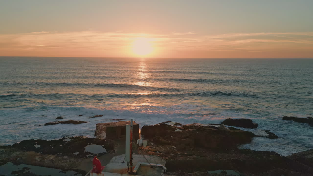 Aerial golden sundown horizon over beautiful endless ocean. Bright orange sunset