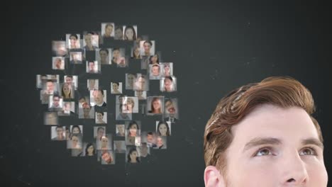 animation of a caucasian man looking at a globe of people pictures spinning