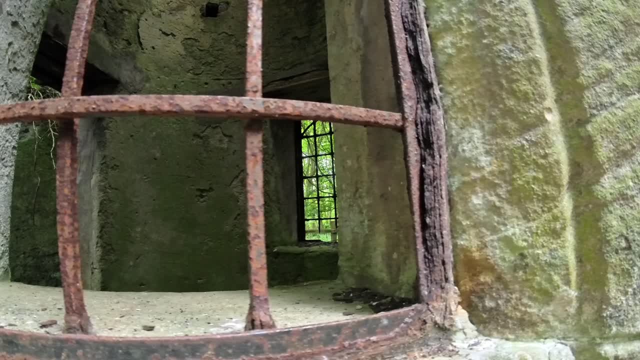 Old medieval stone castle rusted iron bars covering open window for protection