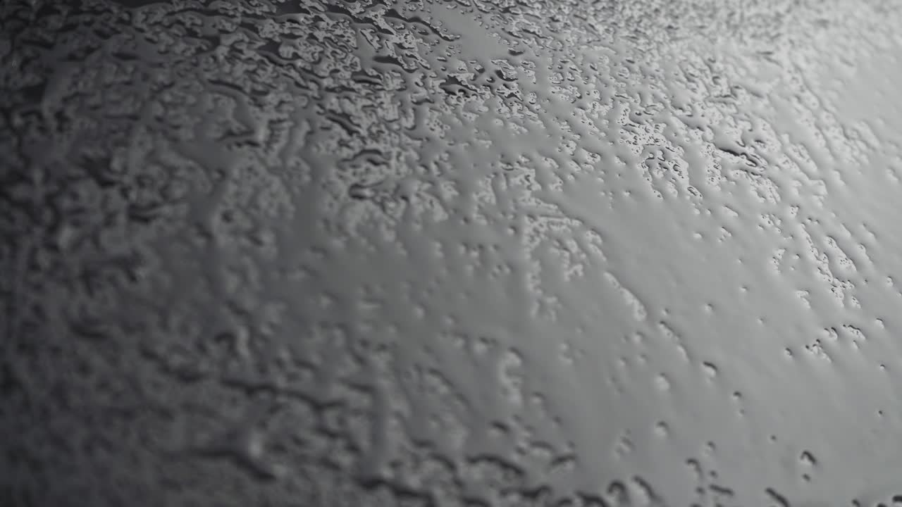 disparo de gotas de pulverización sobre un fondo negro