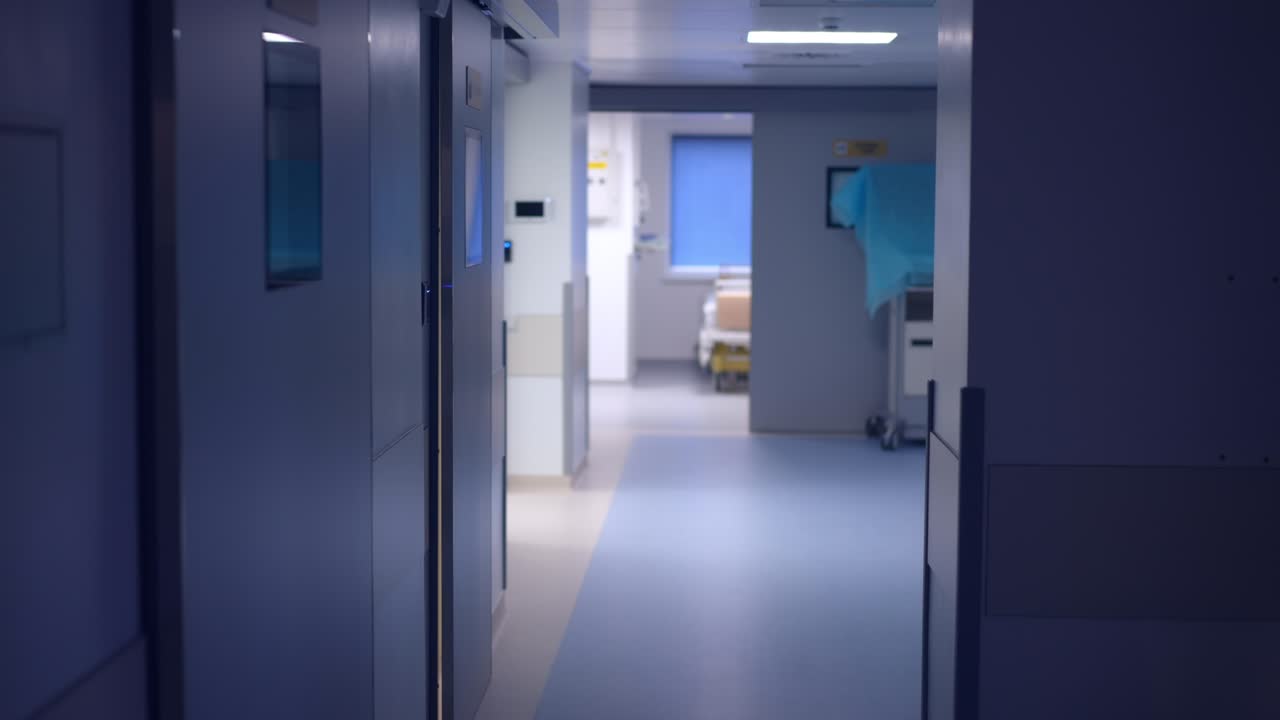 Interiors of modern medical clinic hallway with no people. Wide shot hospital corridor indoors. Medicine and health care concept.