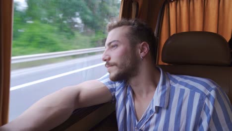 Stylish-young-man-travels-in-car.