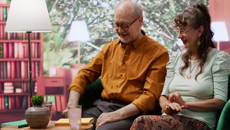 elderly couple putting effervescent vitamin pill in a glass of water