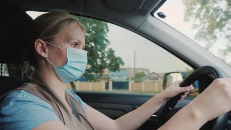 the driver in a gauze bandage driving a car