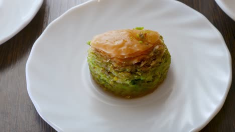 natural sweet baklava with pistachio dessert on white plate