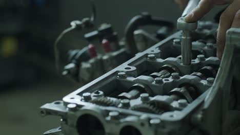 open car engine close-up. an auto mechanic in a garage repairing a car engine after removing a cover. car engine repair. car service