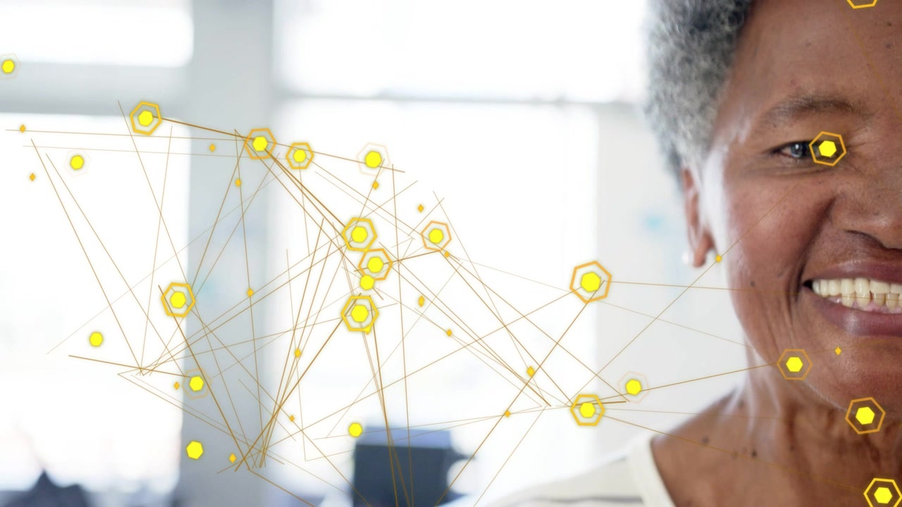 Senior woman reacting to animated hexagonal nodes moving, opening eyes, turning, smiling for tech