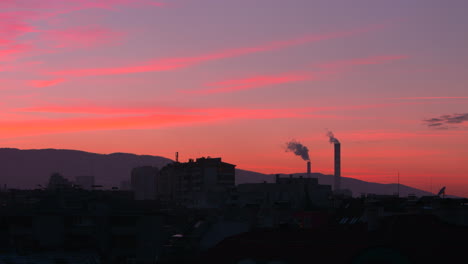 purple sunset over chimneys in sofia, bulgaria