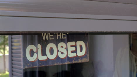 woman closing the shop or cafe