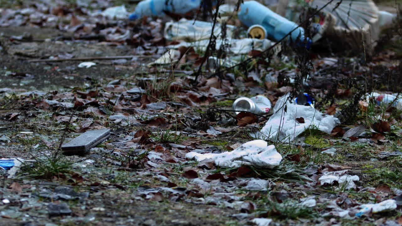 Garbage lying on withered grass