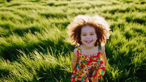 happy girl playing in a field