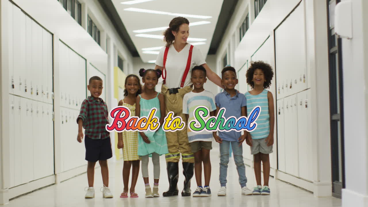 Animation of back to school text in rainbow colours over happy diverse female teacher and children