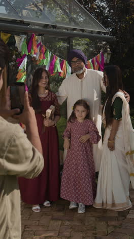 multi-generational indian family portrait in a festive garden setting