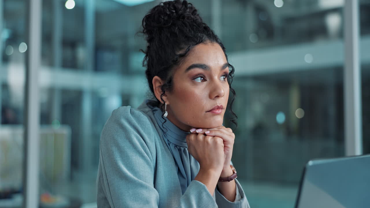 Woman in Business Office Thinking