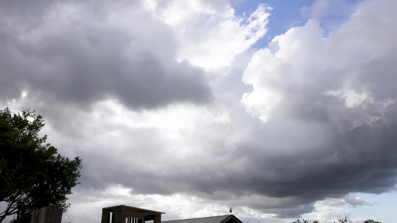 Clouds move swiftly across the sky in Byron Bay, creating a dynamic and dramatic atmosphere