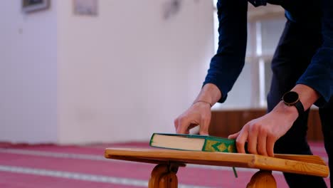 man reads the quran in mosque 2