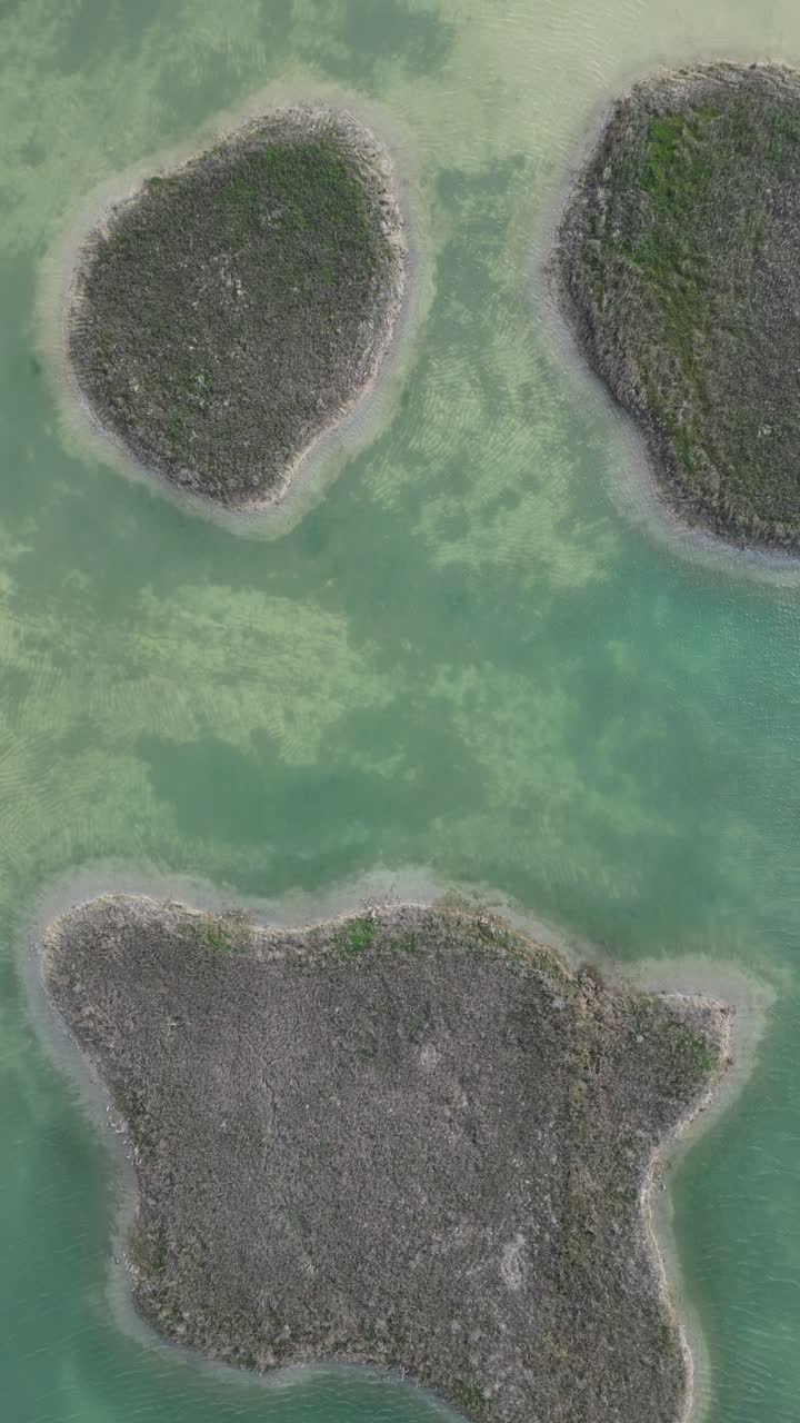 Rippling lake in mountainous countryside on sunny day in la Rioja Spain