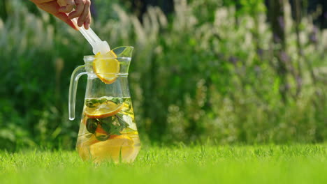 refreshing iced tea in glass pitcher