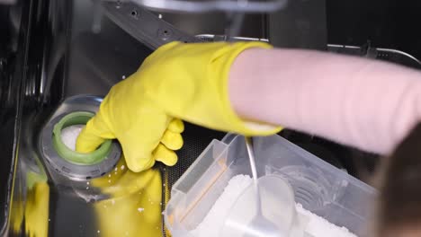 adding dishwasher salt