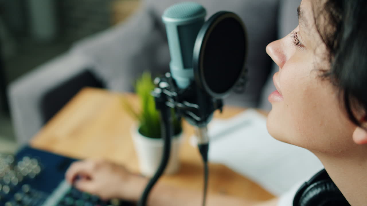 Person recording podcast or audio content.