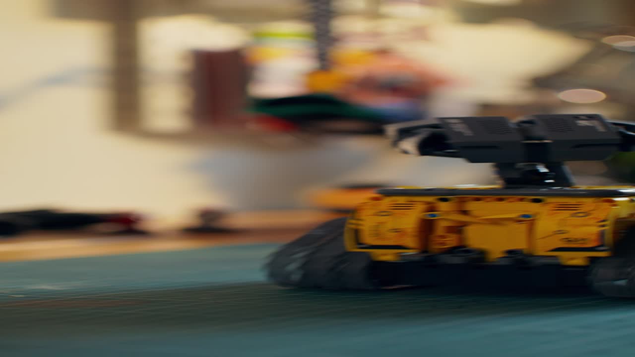 Close-up view of a small toy robot on a desk