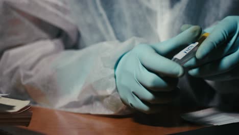 test tube with crime evidence for forensic analysis, placing sticker closeup shot
